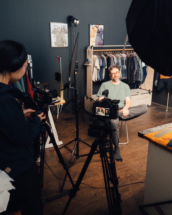 interview setup with a man, light and a camera